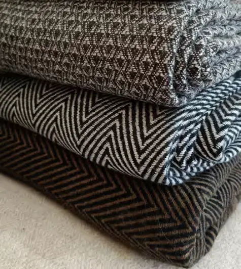 Cashmere throws with a textured geometric weave