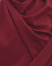 Wine red pashmina fabric arranged in soft folds